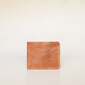 Front view of tan bifold wallet made from upcycled leather and hand stitched with yellow thread