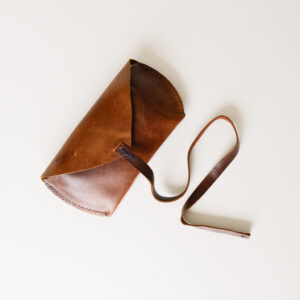 Brown leather glasses/sunglasses case with leather cord closure. Made from reclaimed and upcycled leather