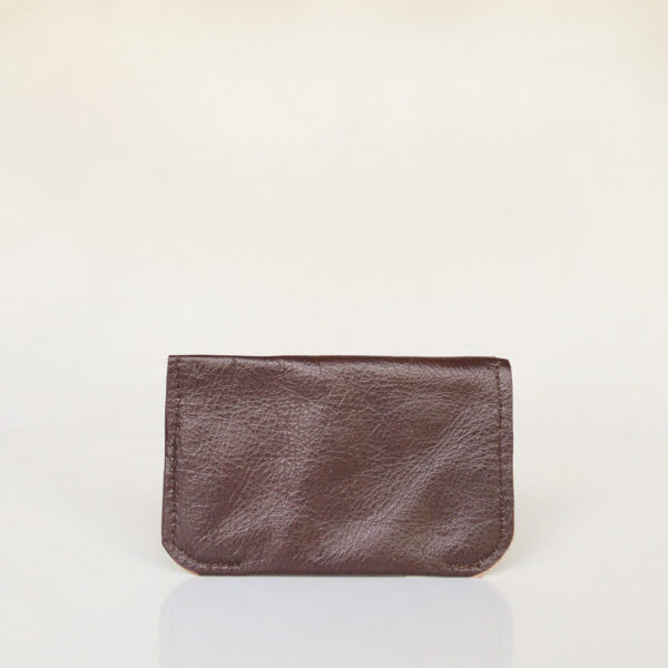 Back view of dark brown and cream minimalist card wallet made from reclaimed and upcycled leather