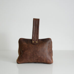 Leather door stop with handle made from reclaimed leather
