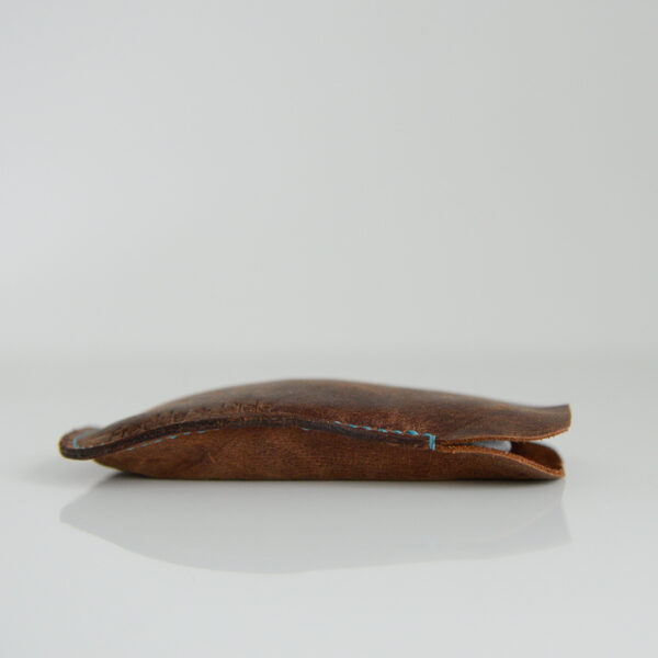 Side view of pouch for apple magic mouse made from reclaimed and recycled brown leather