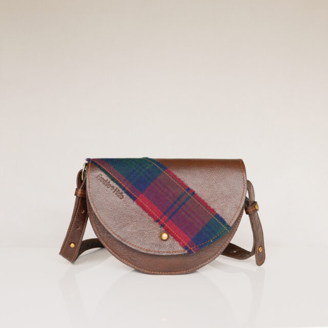 Unique brown bag made from upcycled leather with tartan across flap and on strap