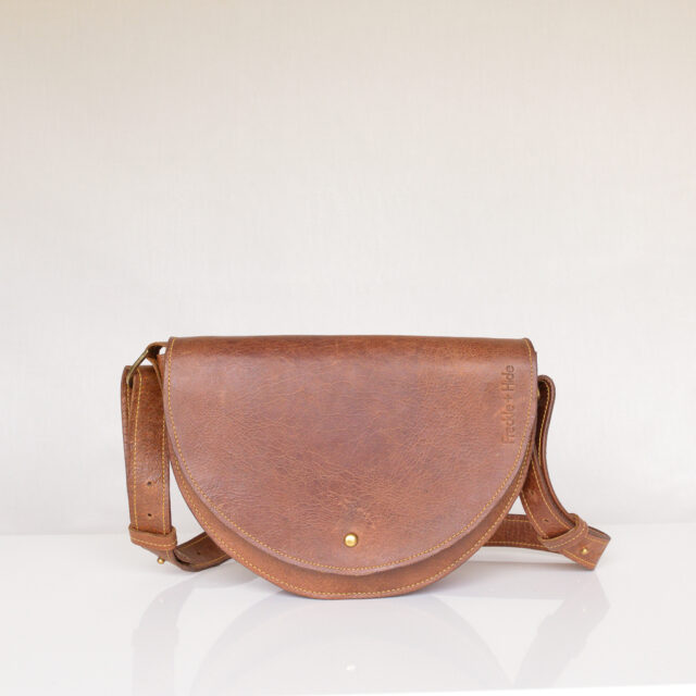 Luxury tan leather shoulder bag with yellow stitching and adjustable strap