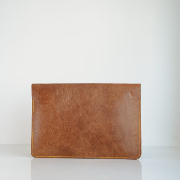 Rear view of brown recycled leather laptop pouch with yellow stitching