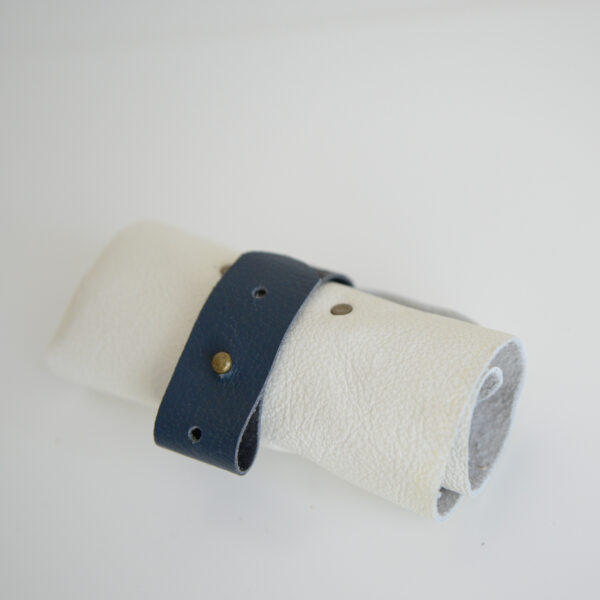 Cream and blue reclaimed leather roll for cables, headphones and chargers