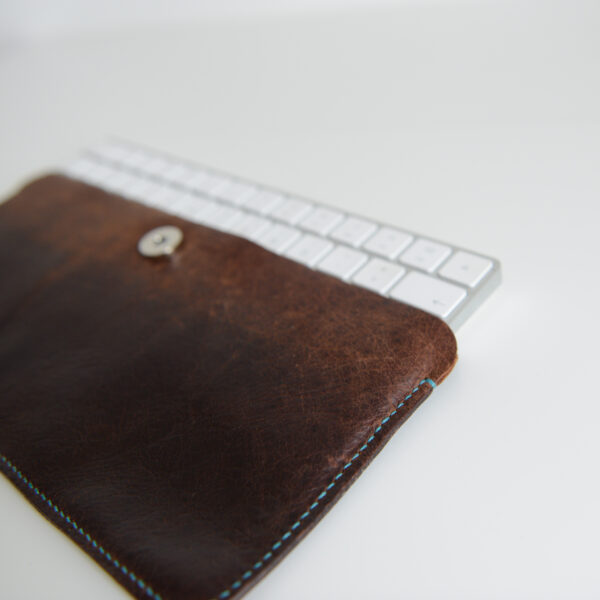 Keyboard case made from repurposed brown leather hand stitched with eco friendly waxed linen thread