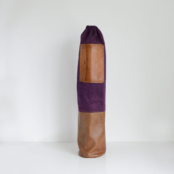Yoga mat bag made from upcycled leather and reclaimed purple shot silk with yellow stitching