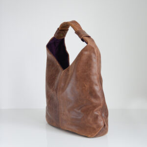 Side view of handmade leather boho tote bag made from reclaimed leather
