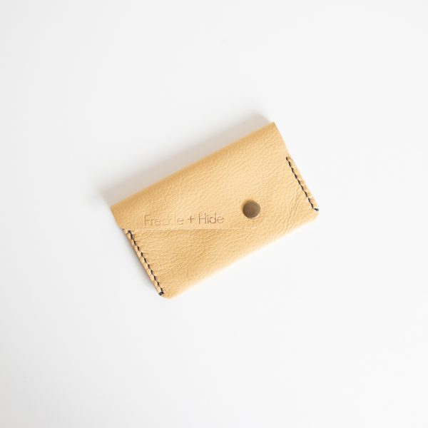 Yellow card wallet made from leather reclaimed from old sofas