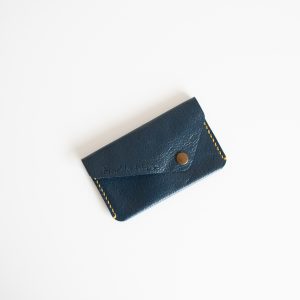 Blue leather card wallet with brass popper and hand stitched with contrasting yellow thread