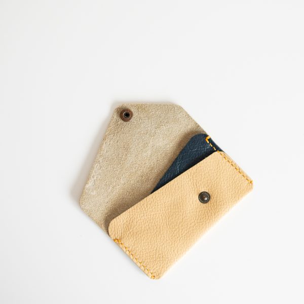 Open view of yellow and blue card wallet made from reclaimed leather