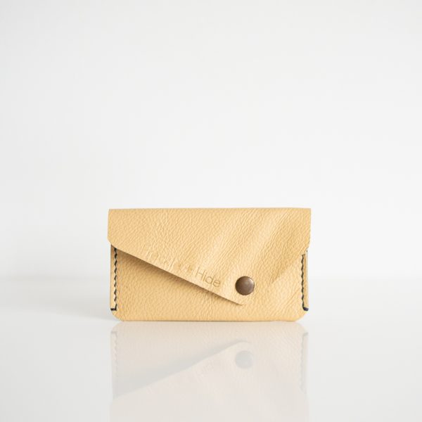 Card wallet made from upcycled sofa leather in yellow with blue stitiching