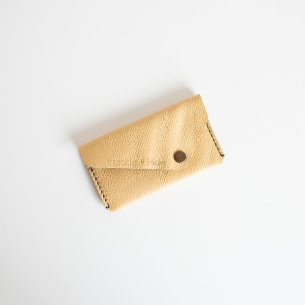 Handmade zero waste card wallet made from repurposed leather.