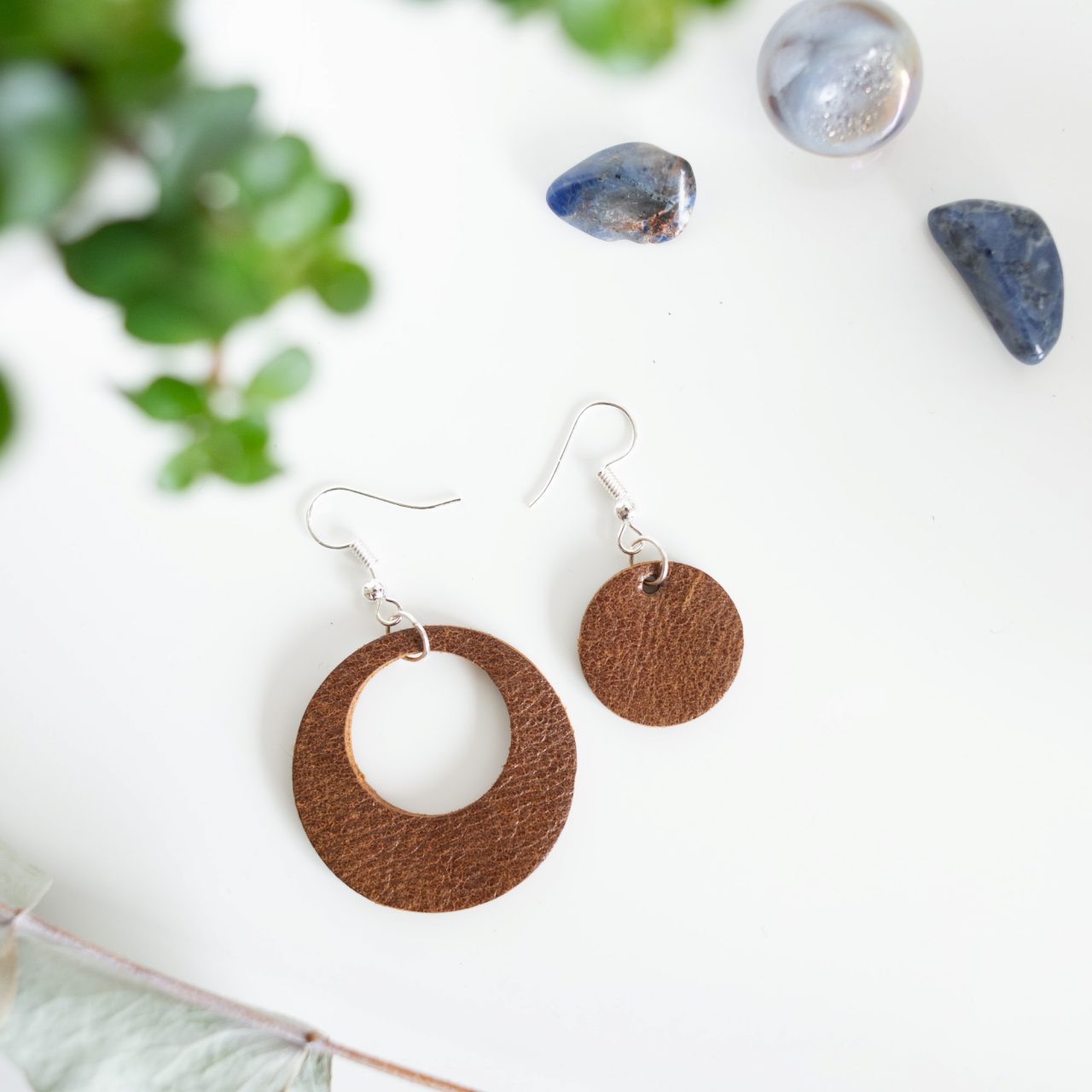 Brown asymmetric earrings made from reclaimed leather