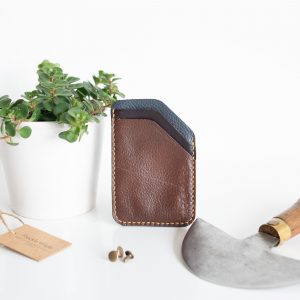 Minimalist credit card wallet made from brown and blue leather reclaimed from old sofas
